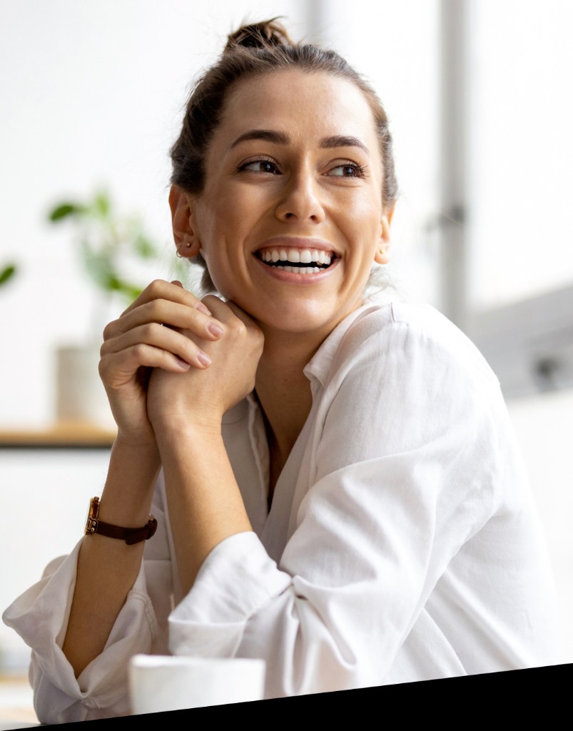 Smiling professional in front of a bright background